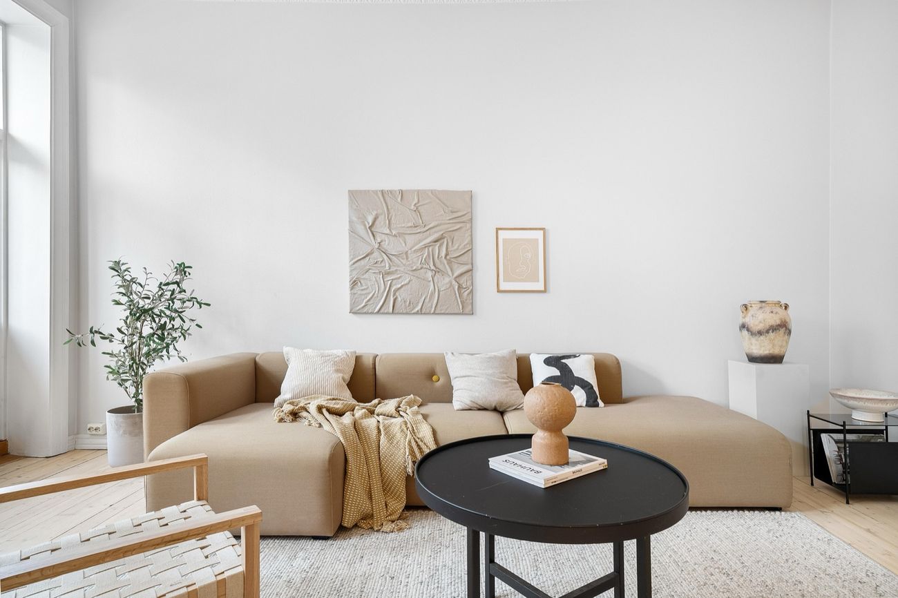 A bright living room with a beige sofa